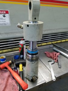 Resealing cylinders on a main ram hydraulic cylinder from an Accurshear metal shear